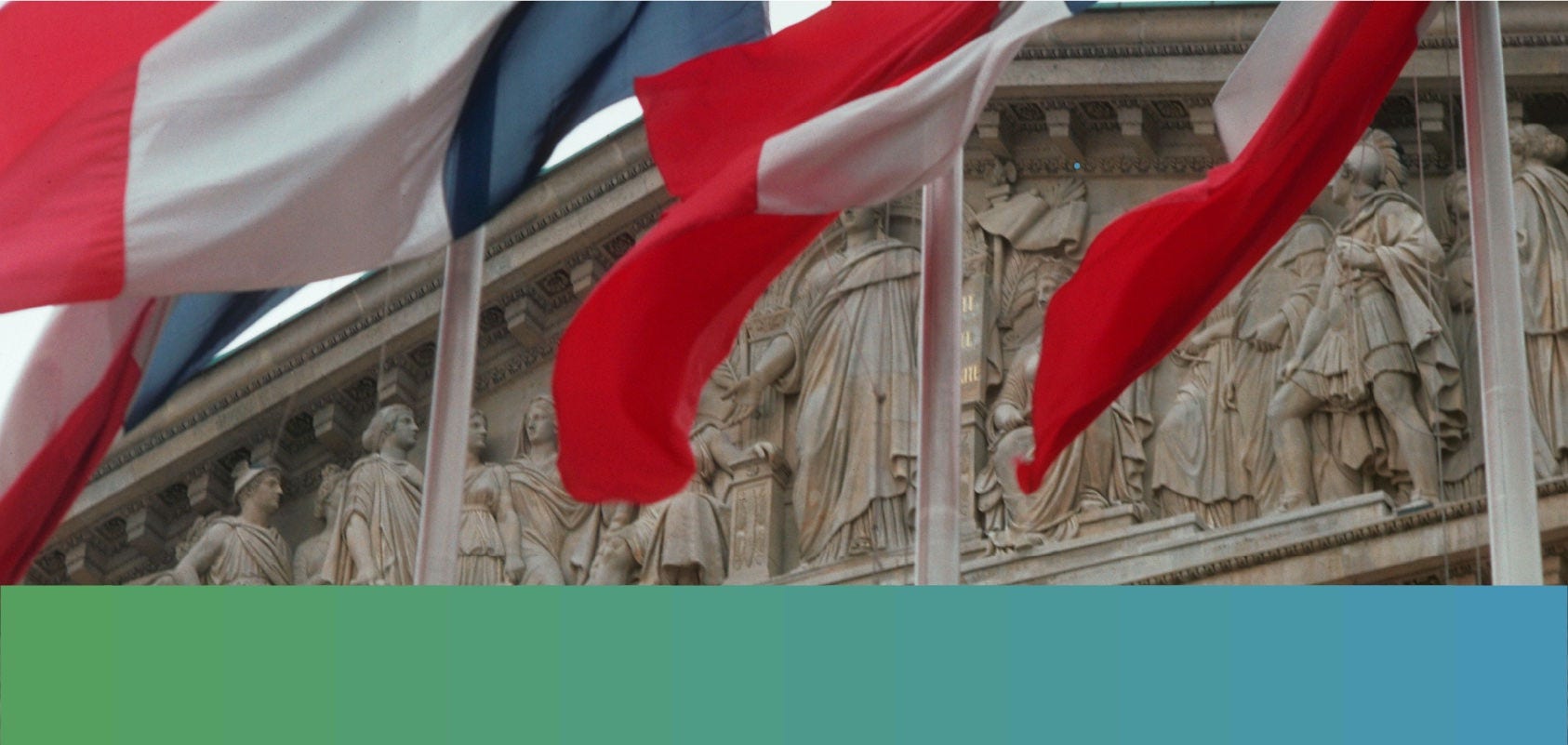 French flags in front of the Palais Bourbon in Paris