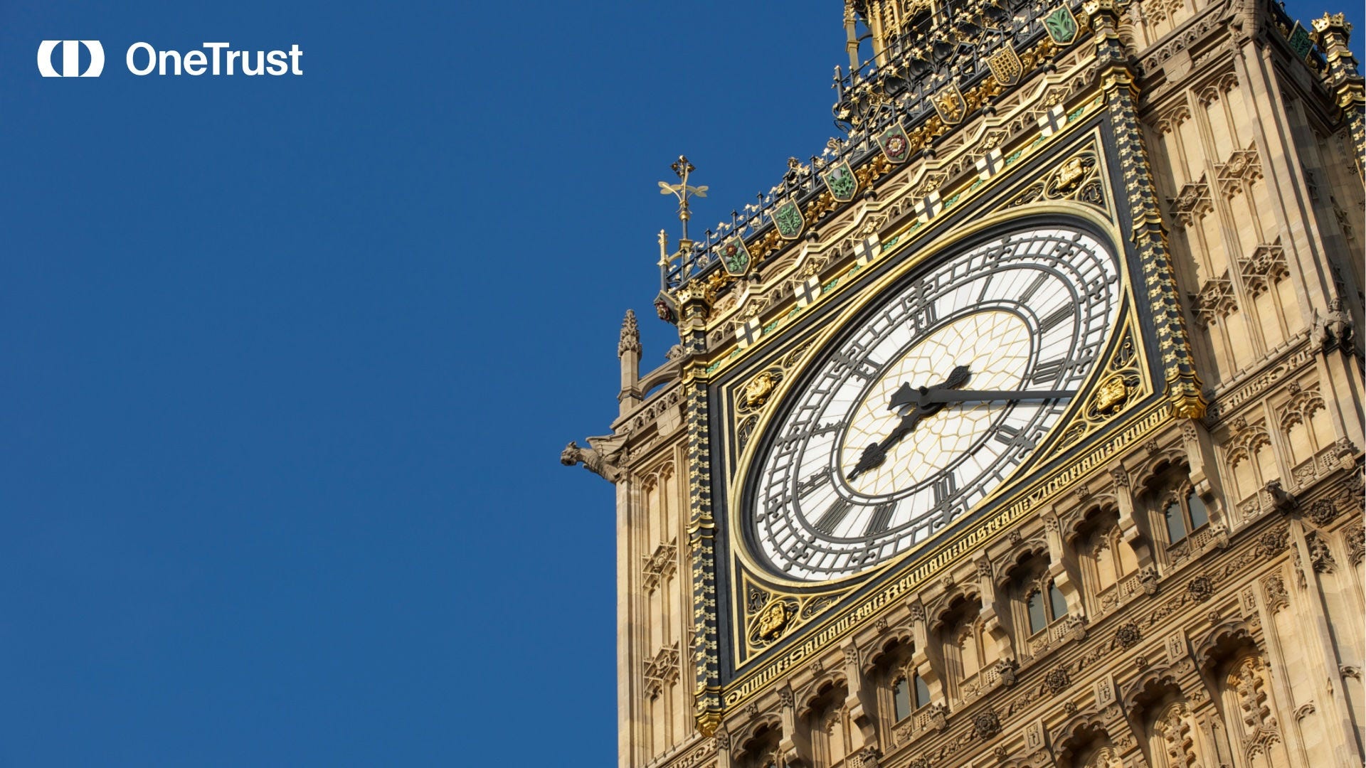 OneTrust logo beside a close-up of the Elizabeth Tower clock face in London against a clear blue sky.