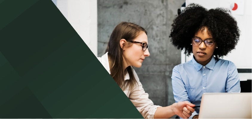 Two women have a discussion at work